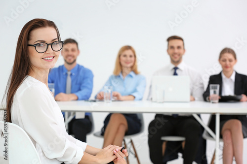 Job interview concept. Human resources commission interviewing woman