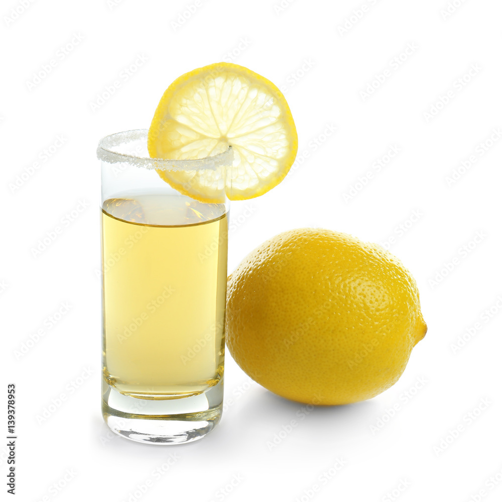 Golden tequila shot with juicy lemon slice and salt on white background Golden tequila shot with juicy lemon slice and salt on white background