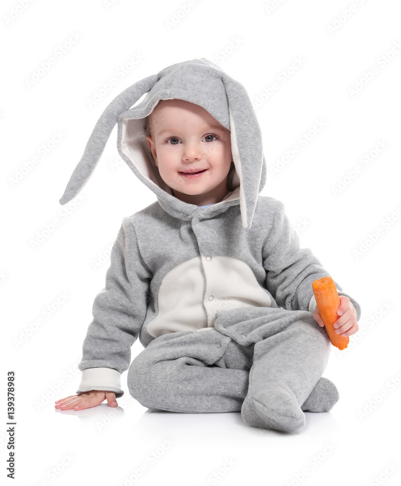 Cute little baby in bunny costume with carrot on white background Cute little baby in bunny costume with carrot on white background