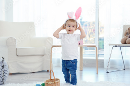 Cute little child in bunny ...