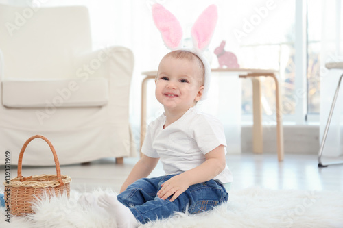 Cute little baby in bunny e...