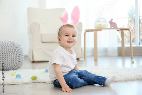 Cute little baby in bunny e...