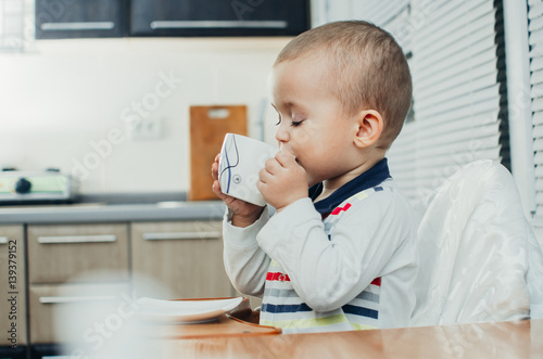 child drinking tea