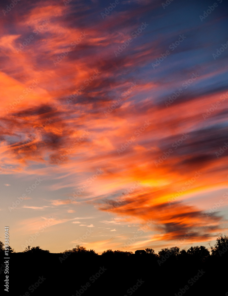 Sunset  with beautiful sky. House with colorful sunset