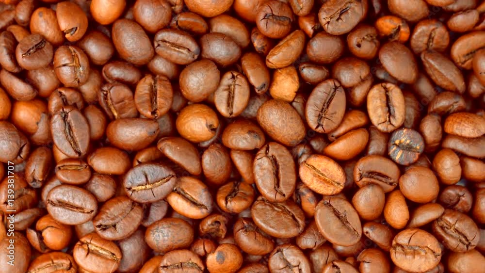 Coffee beans rotating background. Roasted coffee closeup Coffee beans rotating background. Roasted coffee closeup