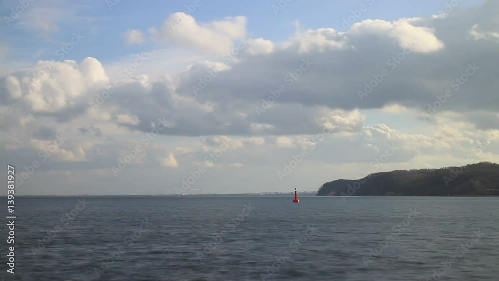 Baltic sea bay Poland. Fluffy clouds on blue sky and cliffs Orlowo in background, timelapse full hd Baltic sea bay Poland. Fluffy clouds on blue sky and cliffs Orlowo in background, timelapse full hd