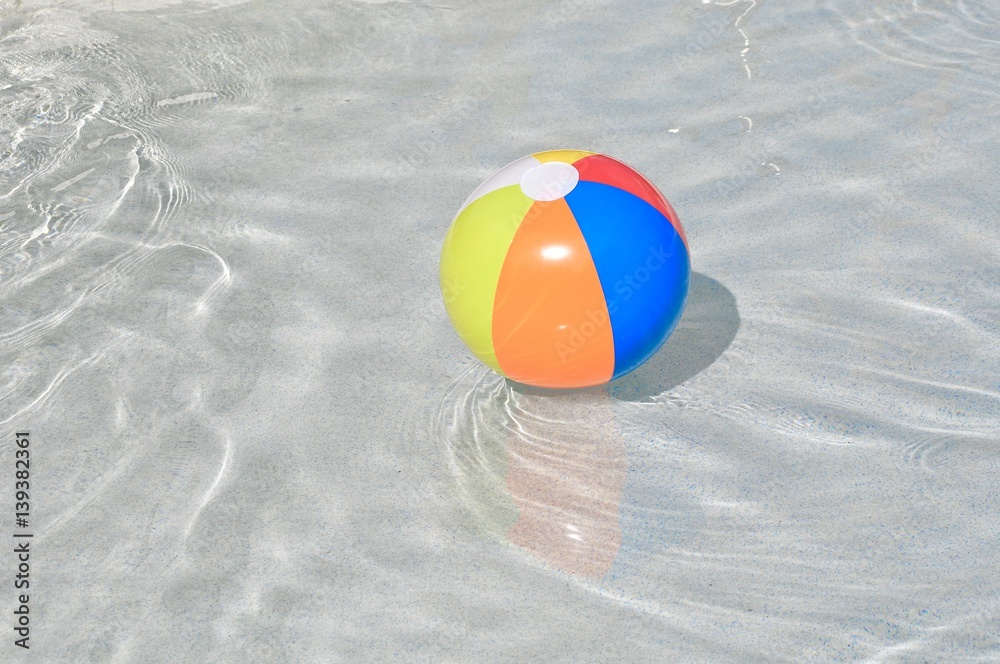 Naklejka premium Floating swimming pool ball in children's pool