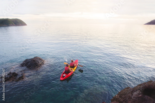 aerial view of kayak in the sea at sunset beach