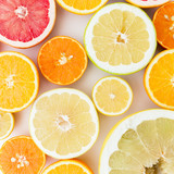 Citrus fruits pattern made of lemon, orange, grapefruit, sweetie and pomelo isolated on white background. Flat lay, top view. Fruit background