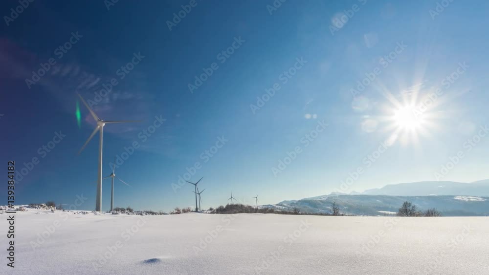 Typical windmill or aerogenerator of aeolian energy on snowy landscape Typical windmill or aerogenerator of aeolian energy on snowy landscape
