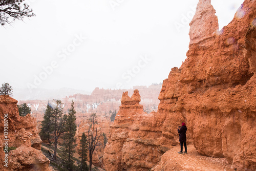 A woman taking photograph in Bryce Canyon