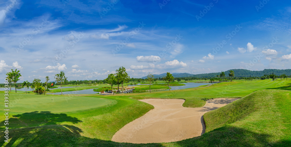golf course green under blue cloud sky for scene background golf course green under blue cloud sky for scene background