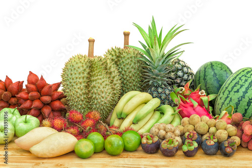 Fototapeta Naklejka Na Ścianę i Meble -  Fresh mixed fruits on wood table isolated on white background.