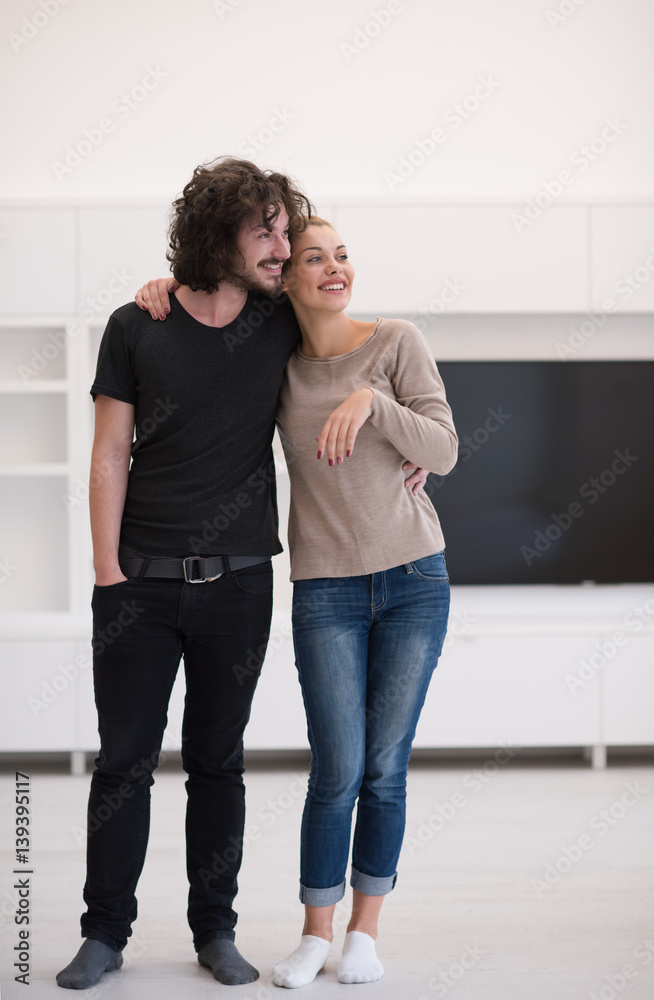 couple hugging in their new home couple hugging in their new home