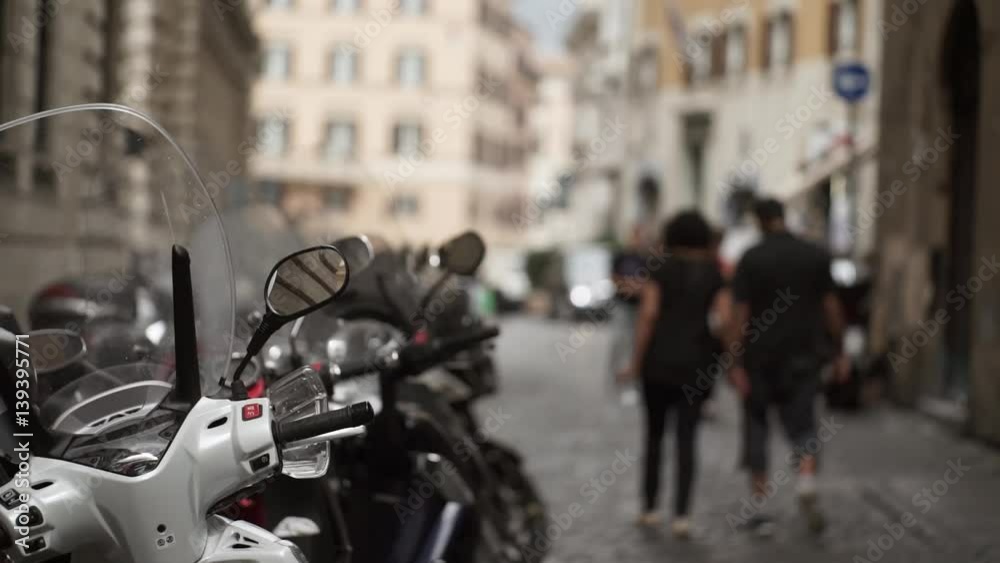Motorbikes parking in street of Rome at cloudy day Motorbikes parking in street of Rome at cloudy day