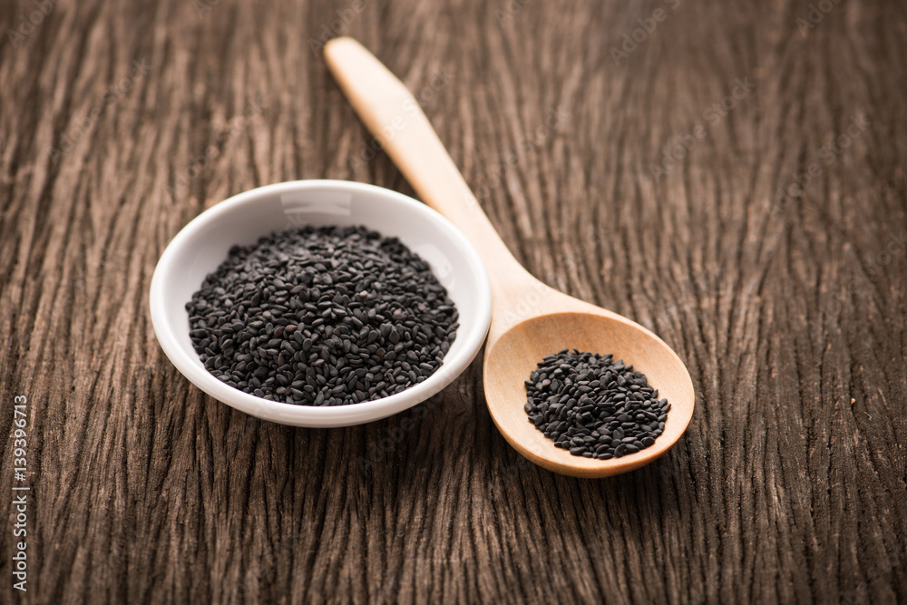 black Sesame close up shot on wood background black Sesame close up shot on wood background