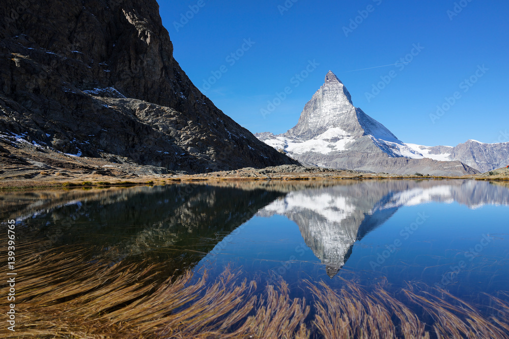 Fototapeta premium mountain Matterhorn with reflection in lake with clear blue sky, beautiful Switzerland