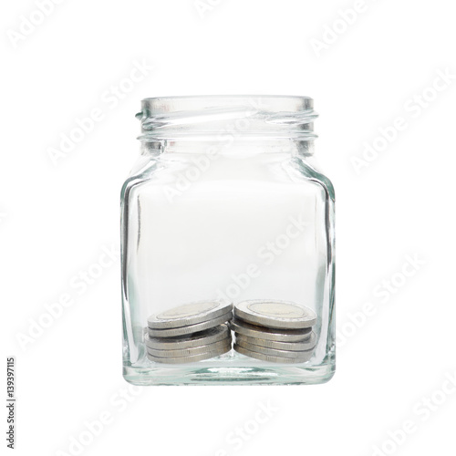 Investment growth concept,money coins in clear jar over white background,saving money