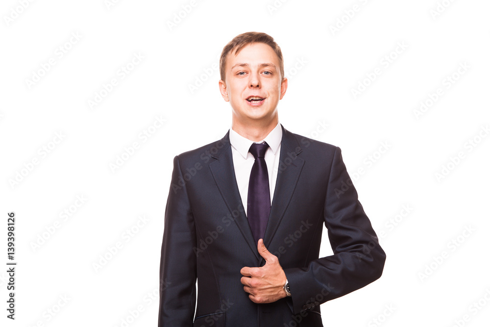Young handsome businessman in black suit is standing straight, portrait isolated on white background Young handsome businessman in black suit is standing straight, portrait isolated on white background