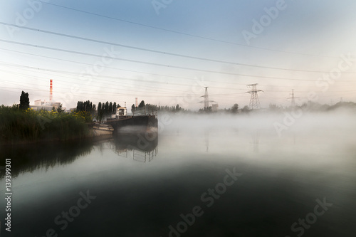 Dawn foggy morning on the lake.