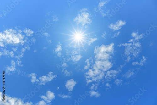 Fototapeta Naklejka Na Ścianę i Meble -  Blue sky with clouds and sun reflection. looking up view
