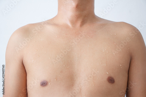 Young man with his full body sweating on a white background.