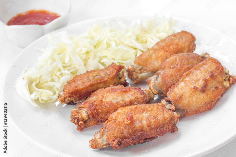 Chicken wings in plate with tomato sauce. Chicken wings in plate with tomato sauce.