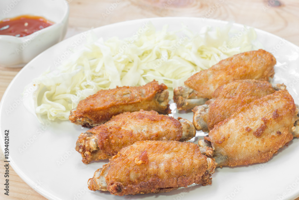 Chicken wings in plate with tomato sauce. Chicken wings in plate with tomato sauce.