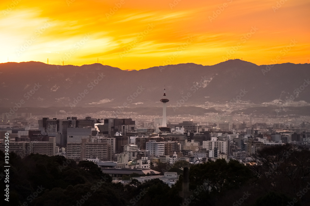 Kyoto City at golden hour with Kyoto Tower in the middle of a frame, Kyoto, Japan