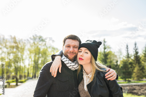 Young outdoor fashion portrait of beautiful couple on the street
