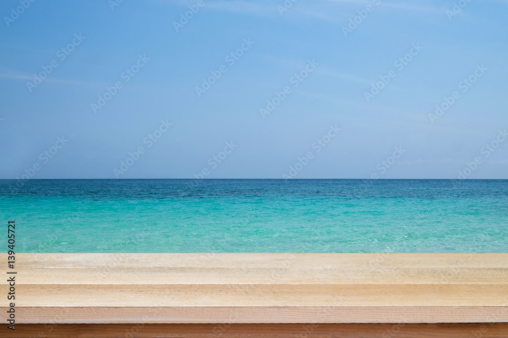 Wood floor scene of beautiful blue sky over sea beach. Summer holiday relax background with copy space for decorate design. Wood floor scene of beautiful blue sky over sea beach. Summer holiday relax background with copy space for decorate design.