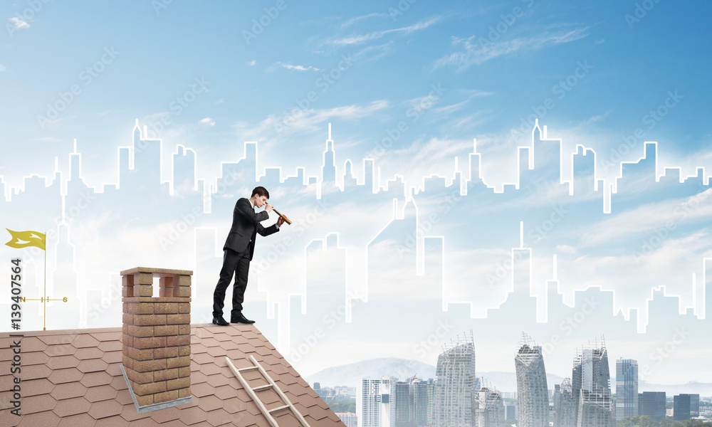 Engineer man standing on roof and looking in spyglass. Mixed media Engineer man standing on roof and looking in spyglass. Mixed media