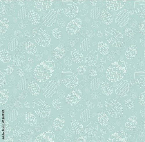Seamless background for happy Easter day. The decorative Easter eggs with different patterns and different sizes on a blue background.
