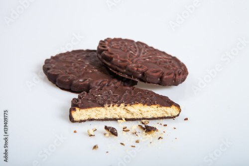 Cookies in chocolate glaze on a light background