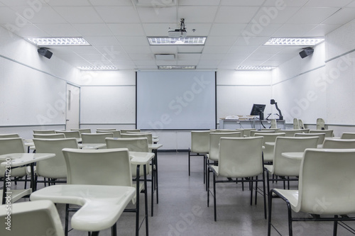 Abstract blur school classroom interior with desk background