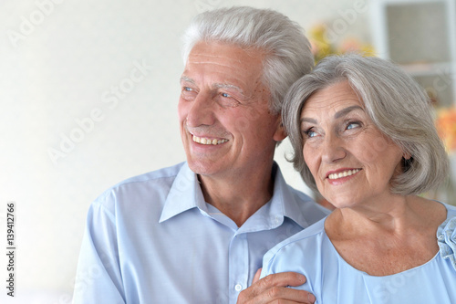 Happy elderly couple embracing