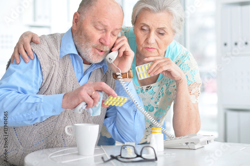 Elderly couple with pills photo