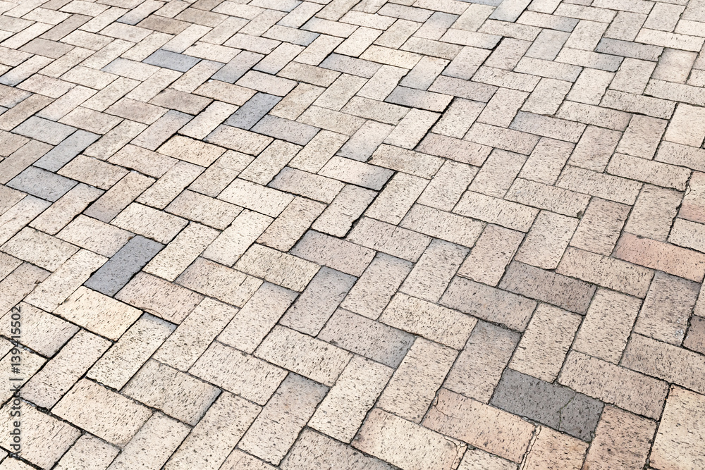 Yellow gray cobblestone pavement, texture