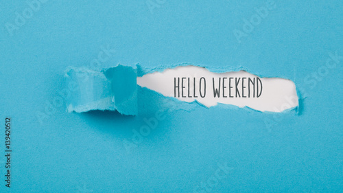 Hello Weekend message on Paper torn ripped opening photo