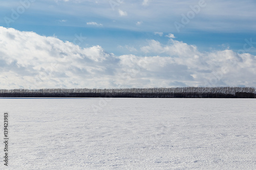 Spring sky over the snowy plain. © VASILEVS