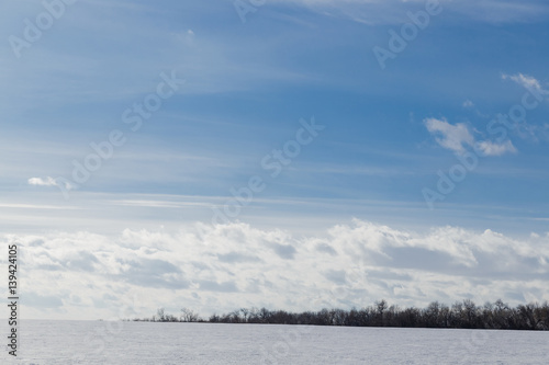 Spring sky over the snowy plain. © VASILEVS