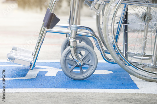 Empty wheelchair parked in hospital