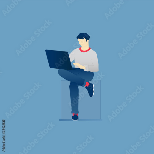 Man sits and works on laptop
