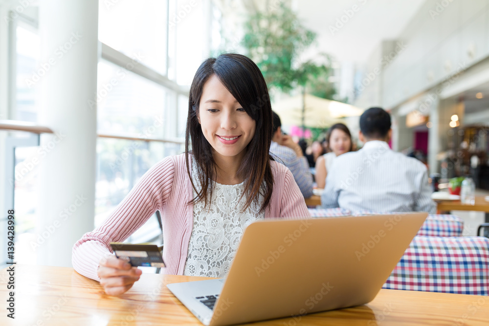 Woman using laptop computer for shopping online Woman using laptop computer for shopping online
