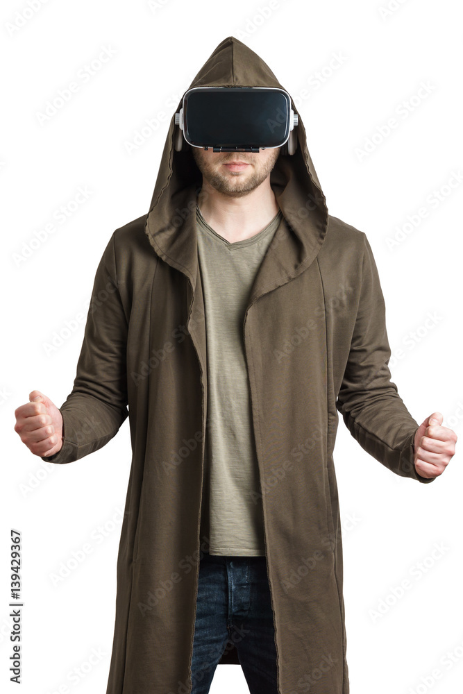 Isolated portrait of an young man in a hoodie wearing vr glasses and clenching his fist. Isolated portrait of an young man in a hoodie wearing vr glasses and clenching his fist.