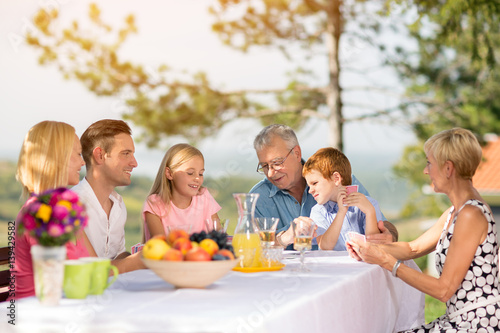 family play cards together.