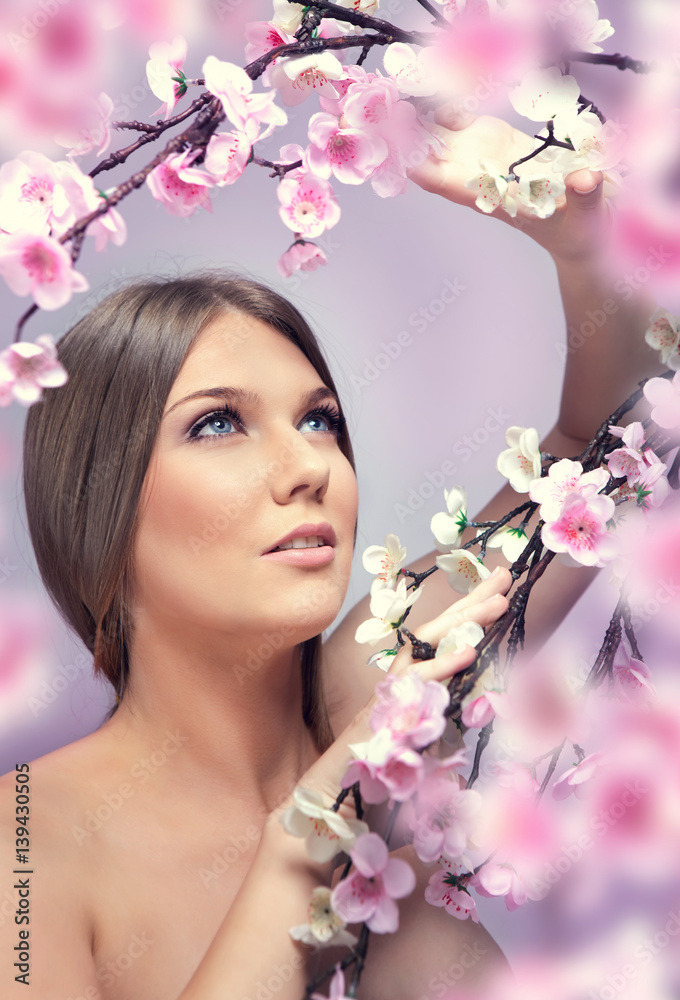 Fototapeta premium young woman with spring flowers