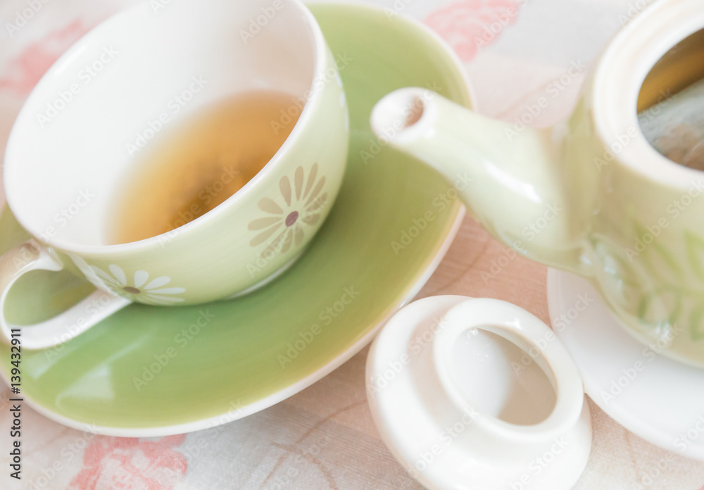 Cup of tea with tea pot for tea time break relaxation Cup of tea with tea pot for tea time break relaxation