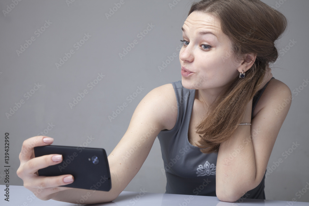 attractive beautiful woman poses for selfie photo (Addiction, selfimaniya, psychotherapy) attractive beautiful woman poses for selfie photo (Addiction, selfimaniya, psychotherapy)