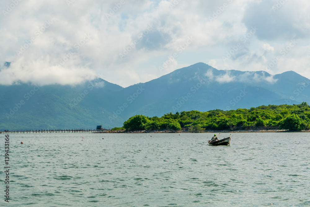 Sea landscape with boats near island shore - the South China sea - Vietnam Nha Trang bay